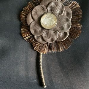 Beautiful brown leather pin .